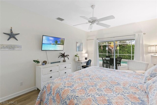 bedroom featuring wood finished floors, visible vents, baseboards, ceiling fan, and access to outside