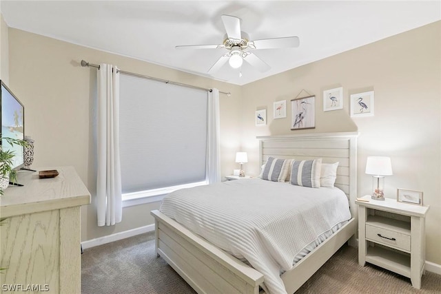 carpeted bedroom featuring baseboards and a ceiling fan