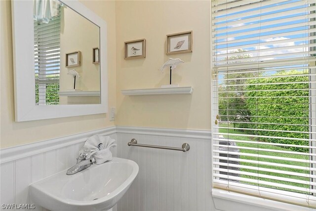 bathroom featuring sink and a wealth of natural light