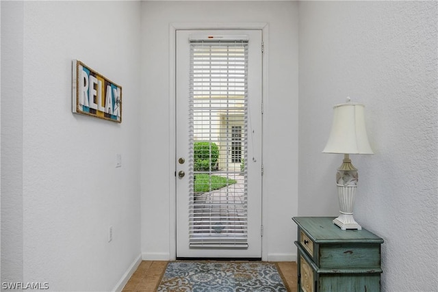 entrance foyer with light tile patterned floors