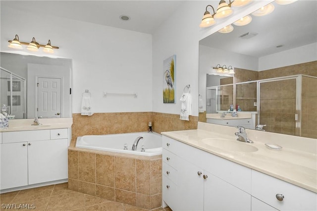 bathroom featuring tile patterned flooring, vanity, and separate shower and tub