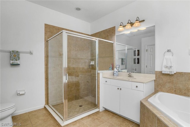 full bathroom with vanity, toilet, tile patterned floors, and plus walk in shower