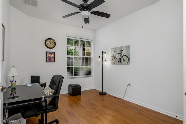 home office featuring ceiling fan and hardwood / wood-style floors