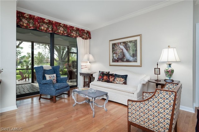 living room featuring hardwood / wood-style flooring and ornamental molding