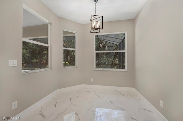 empty room with an inviting chandelier