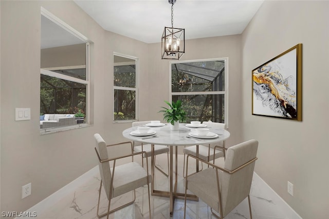 dining space with a notable chandelier