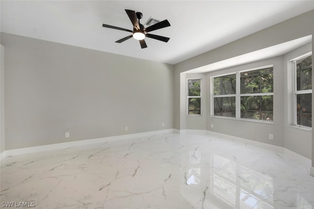 empty room featuring ceiling fan