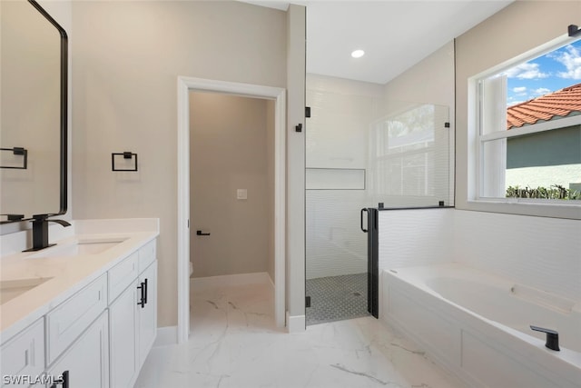 full bathroom featuring vanity, toilet, shower with separate bathtub, and a wealth of natural light