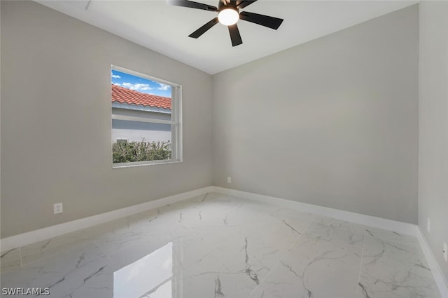 spare room with ceiling fan