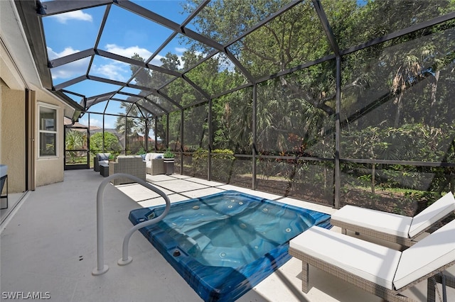 view of swimming pool with a jacuzzi, a patio, glass enclosure, and an outdoor hangout area