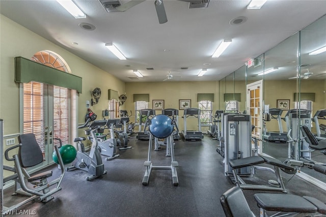 gym with ceiling fan and french doors