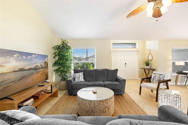 living room featuring ceiling fan and vaulted ceiling