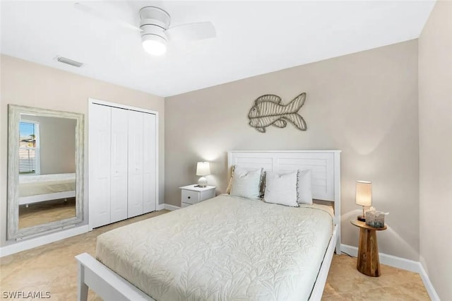 tiled bedroom with a closet and ceiling fan