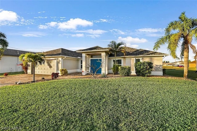 view of front of house featuring a front lawn and a garage