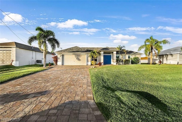 ranch-style home featuring a garage, a front lawn, and cooling unit