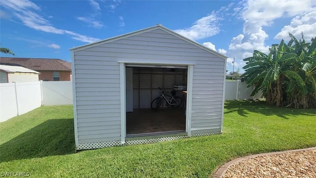 view of outdoor structure featuring a lawn