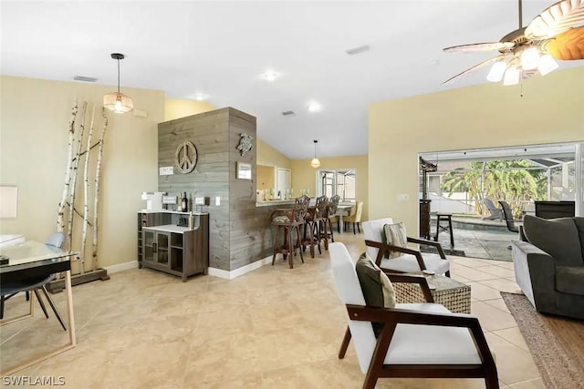 living room with ceiling fan and lofted ceiling