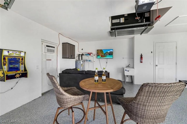 dining space with water heater and sink