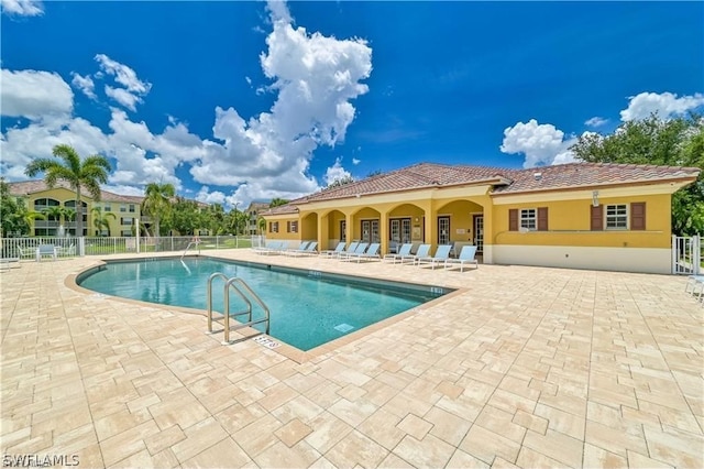 view of swimming pool with a patio area