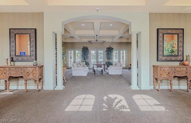 interior space with beam ceiling, coffered ceiling, carpet floors, and ornate columns