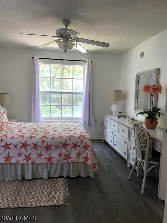 bedroom with ceiling fan and dark hardwood / wood-style flooring