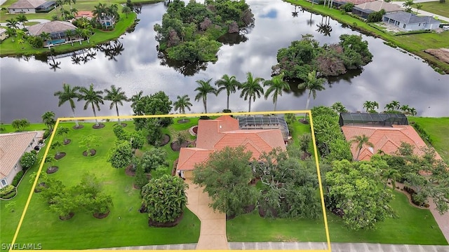 birds eye view of property with a water view