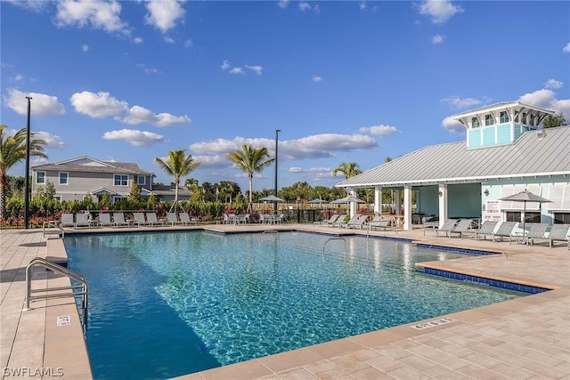 community pool featuring a patio area