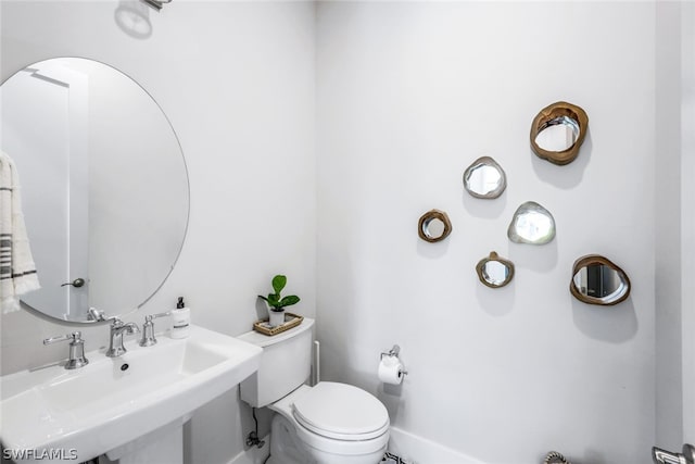 bathroom with toilet and sink