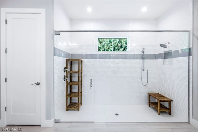 bathroom with tiled shower