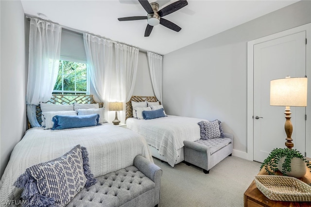 carpeted bedroom featuring ceiling fan