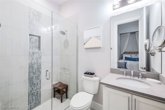 bathroom with a shower with door, vanity, and toilet