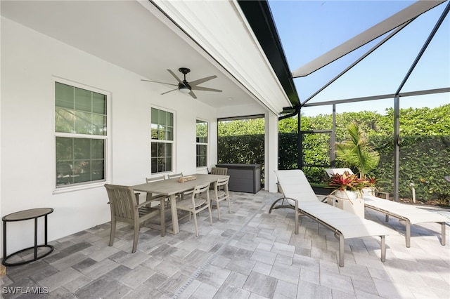 view of patio / terrace with a lanai and ceiling fan