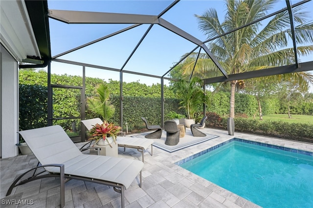 view of pool featuring a lanai and a patio