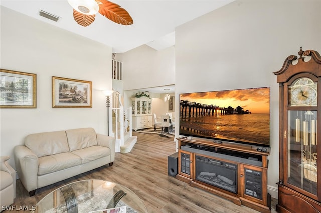 living room featuring hardwood / wood-style flooring and ceiling fan