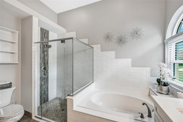 full bathroom with separate shower and tub, vanity, wood-type flooring, and toilet