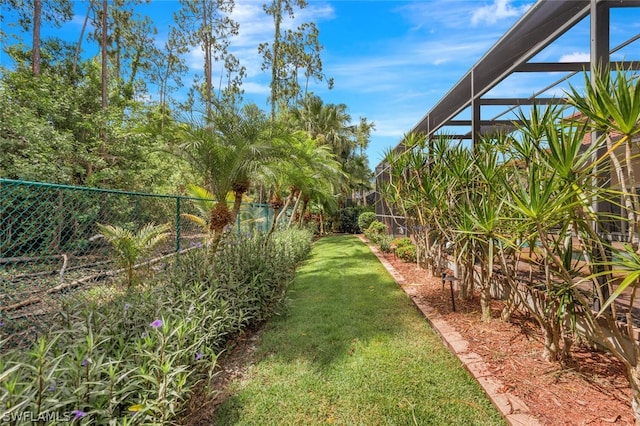 view of yard with a lanai