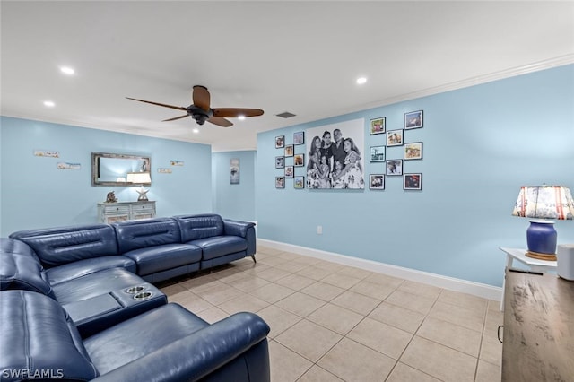 tiled living room with ceiling fan and crown molding