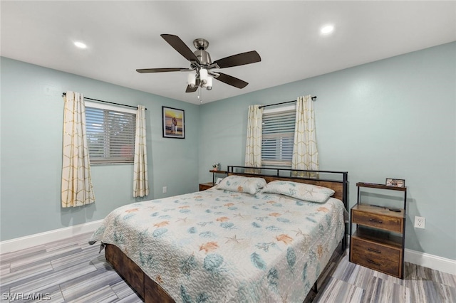 bedroom with hardwood / wood-style floors and ceiling fan