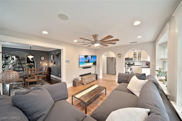 living room featuring ceiling fan