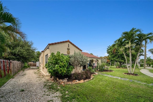 view of home's exterior featuring a yard