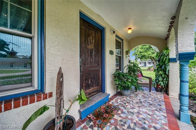 doorway to property with a porch