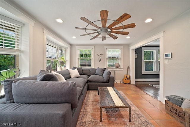 living room featuring tile patterned flooring and ceiling fan