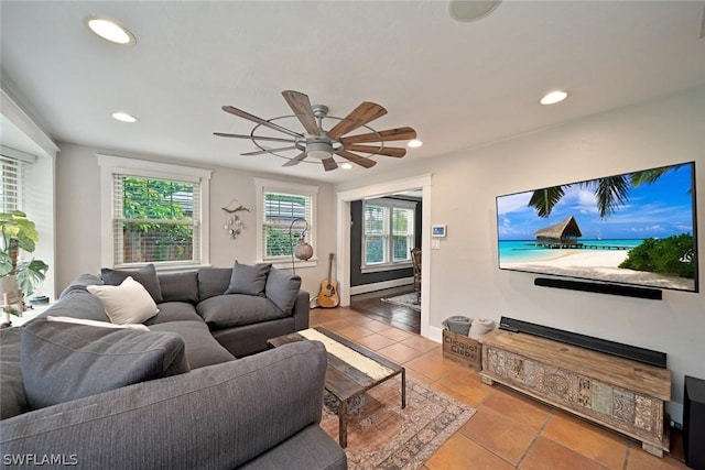 tiled living room featuring ceiling fan