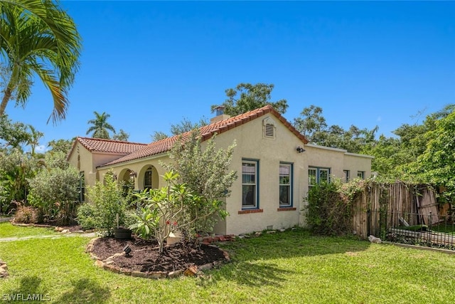 view of home's exterior featuring a lawn