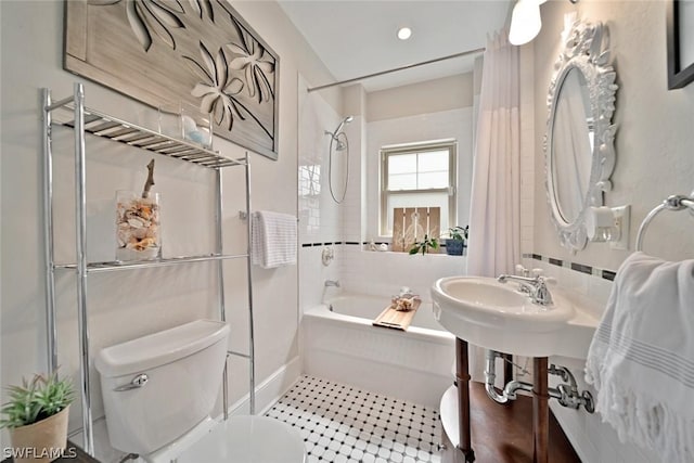 bathroom with toilet and shower / bathtub combination with curtain