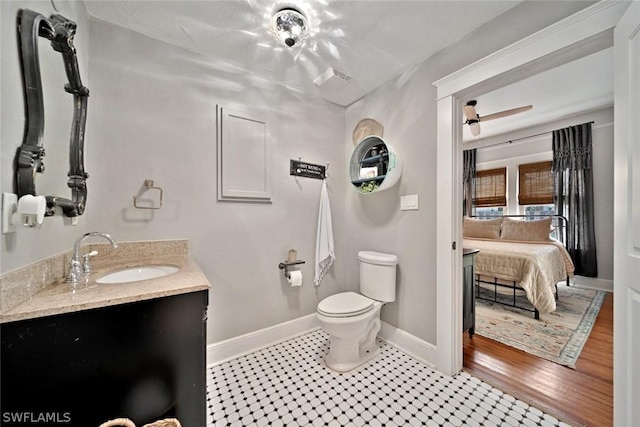 bathroom with tile patterned floors, vanity, and toilet