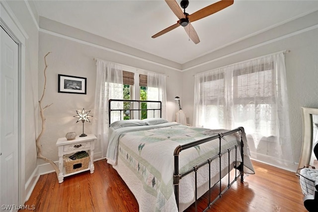 bedroom featuring ceiling fan and hardwood / wood-style floors