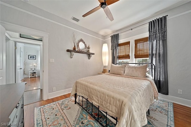 bedroom featuring ceiling fan and light wood-type flooring