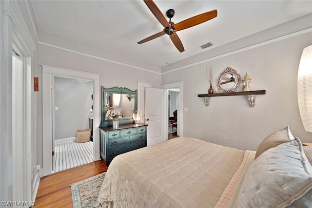 bedroom with light hardwood / wood-style floors and ceiling fan