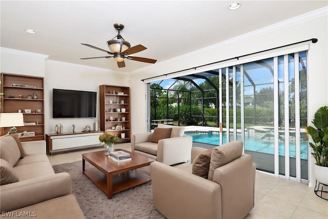 living room with light tile patterned floors, ceiling fan, and ornamental molding